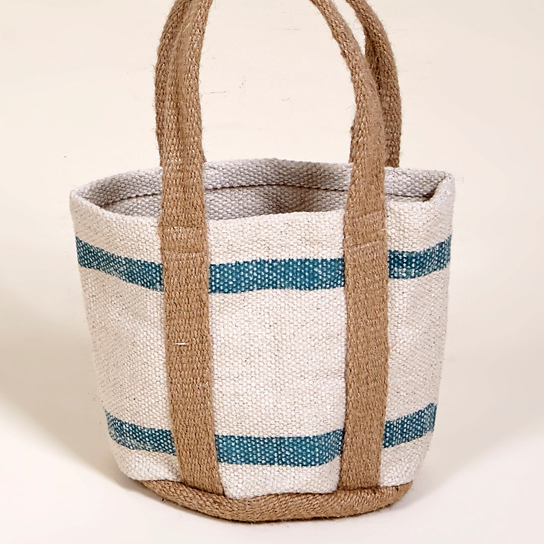 Cesta macetero Ocean de algodón con asas de yute en color blanco y turquesa