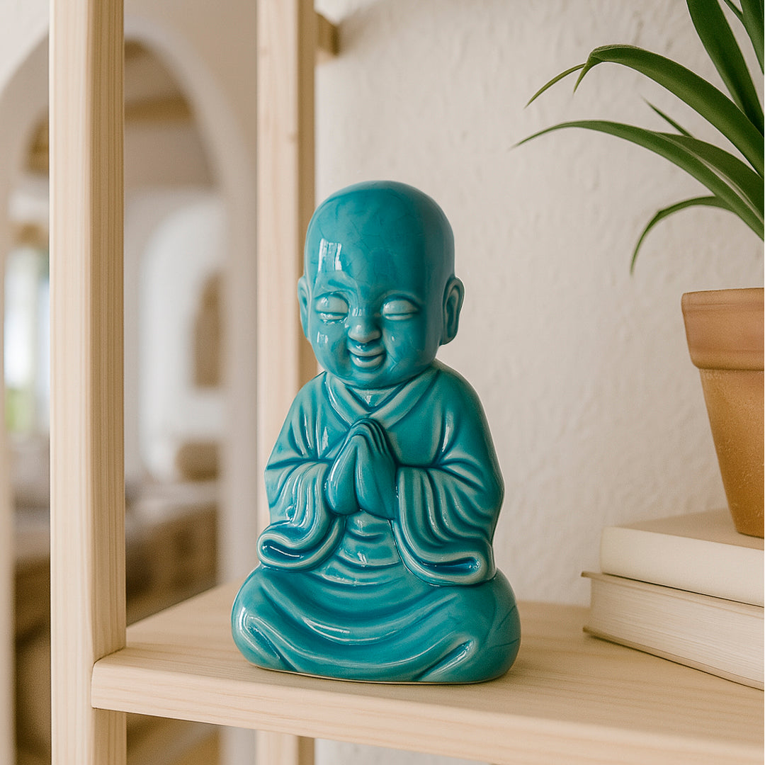 Buda de ceramica en color turquesa cara feliz